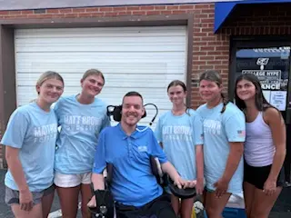 Matt Brown surrounded by the College Hype Team