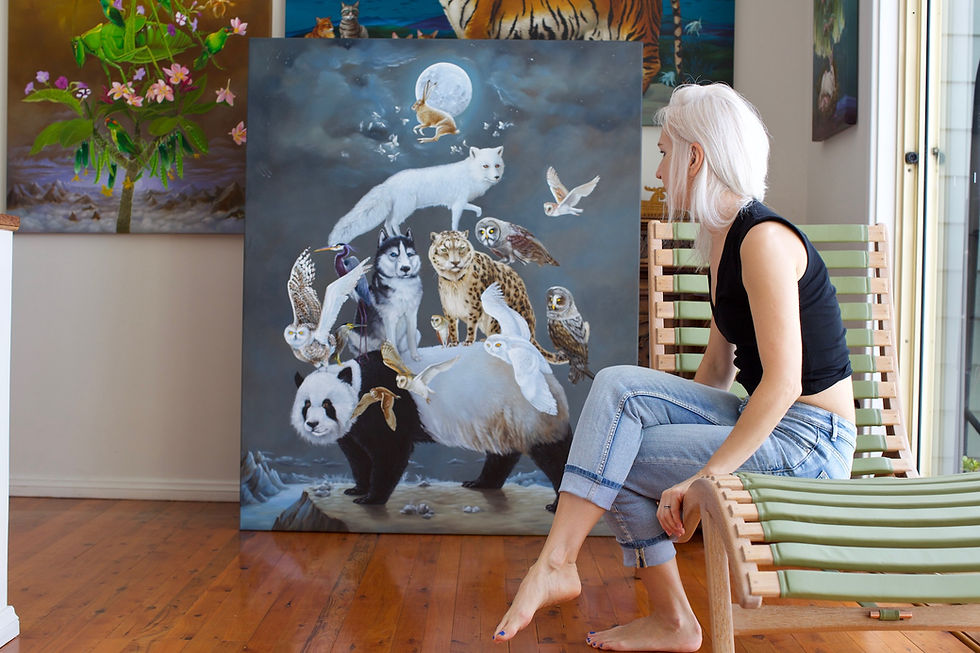Thumbnail: artist in her studio with artworks