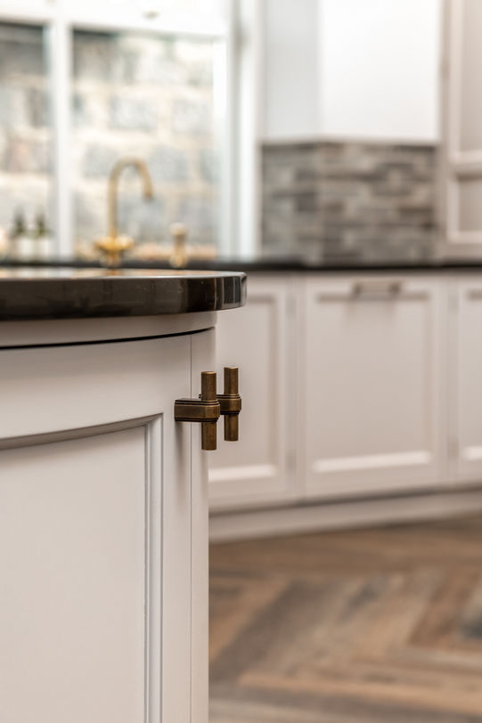 a kitchen with white cabinets and brass handles, , bespoke kitchen design