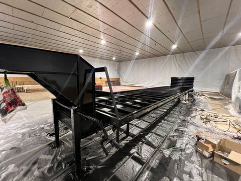 40ft gooseneck trailer with a smooth, newly painted surface after laser blasting and professional repainting in the company’s workshop.