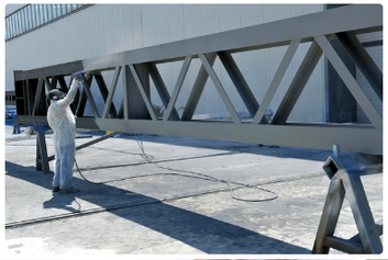 Cowboy Painting Co. pre-painting structural steel components off-site, applying durable coatings to ensure protection and long-term reliability before installation.