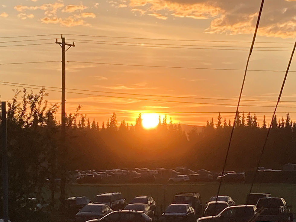 The Sun Sets at Midnight Behind Growden Field. Photo by Paul Baker.