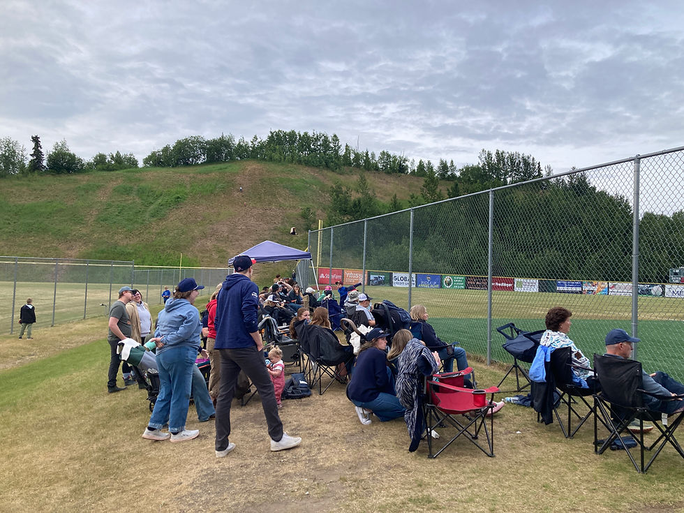 Fans Line up Chairs Along the Fence at Lee Jordan Field. Photo by Paul Baker, Stadium Journey.