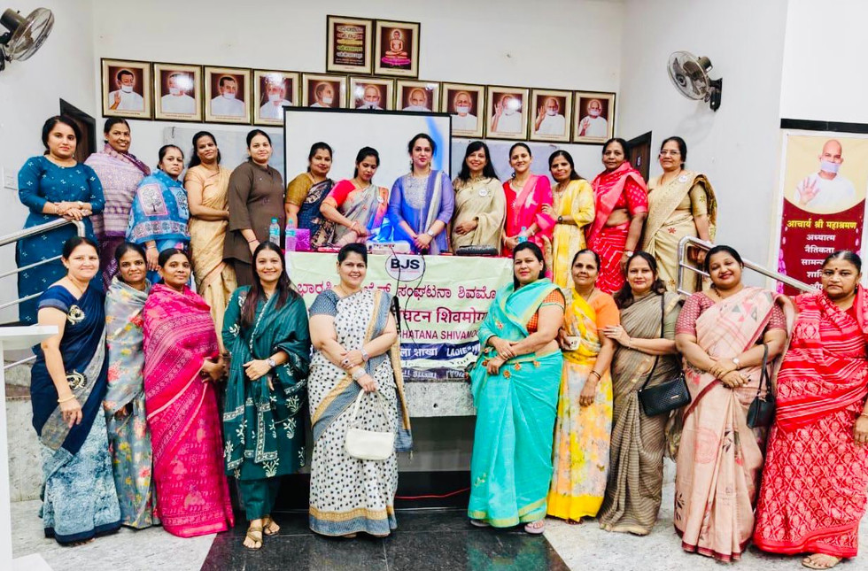 Group of women in traditional Indian attire at an event