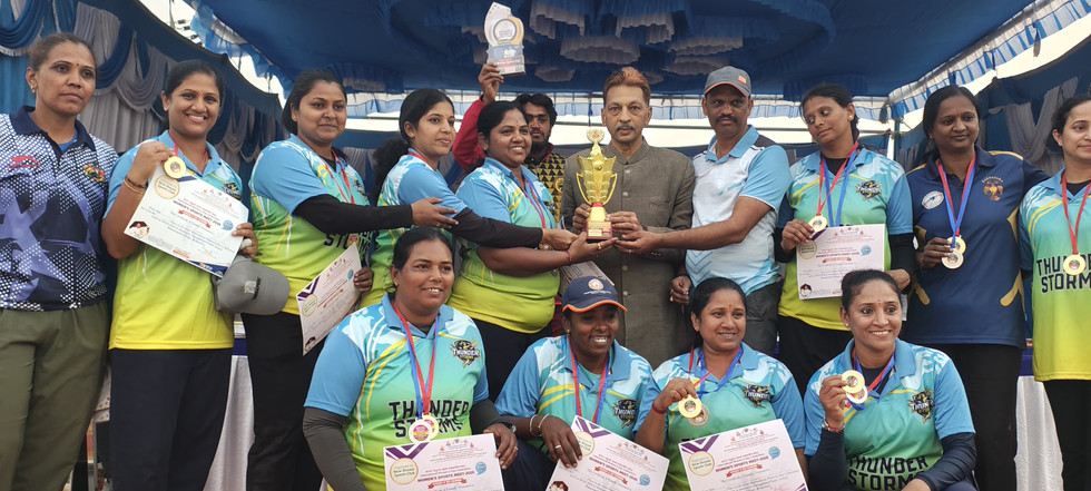 Women celebrating with medals and trophy on International Women's Day