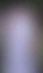 Person in white with mouth covered, hand raised