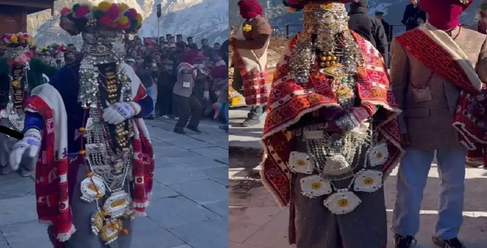 Person in ornate traditional costume with colorful headdress