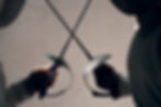 Fencer woman with fencing sword. Fencers duel start concept..jpg