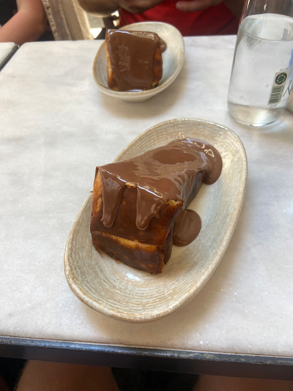 The San Sebastian (Basque) Cheesecake, served with melted chocolate