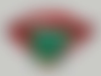 Red lips with a green snake emerging from the mouth against a gray background. The mood is surreal and striking.