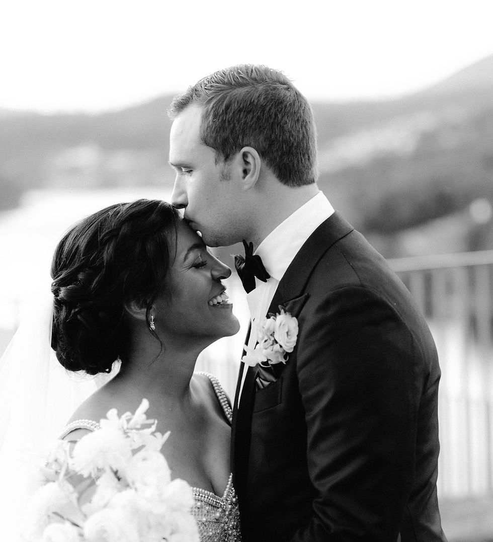 Couple posing for a photo after the wedding.