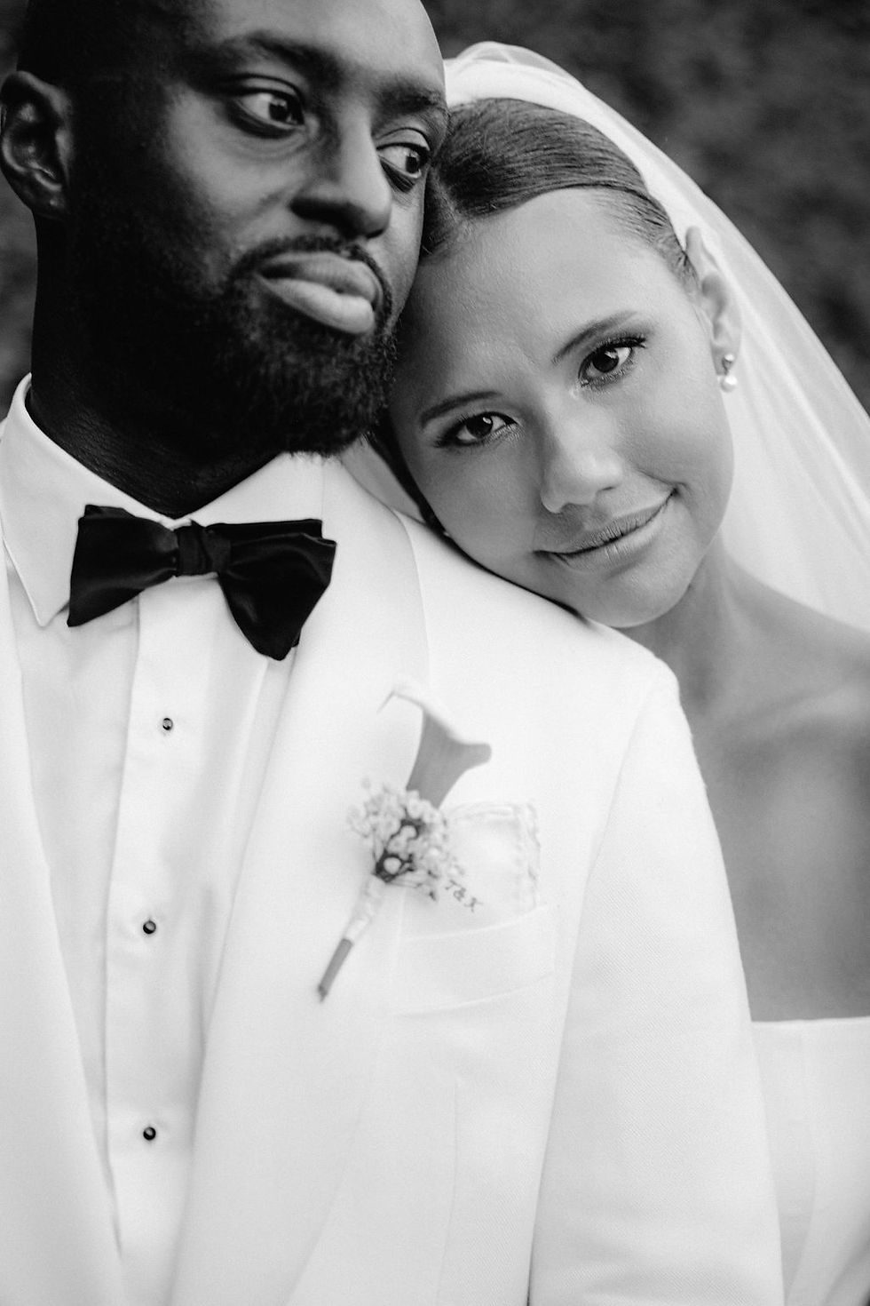 Couple posing for a photo after the wedding.