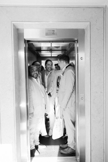 Groom and his groomsmen inside an elevator