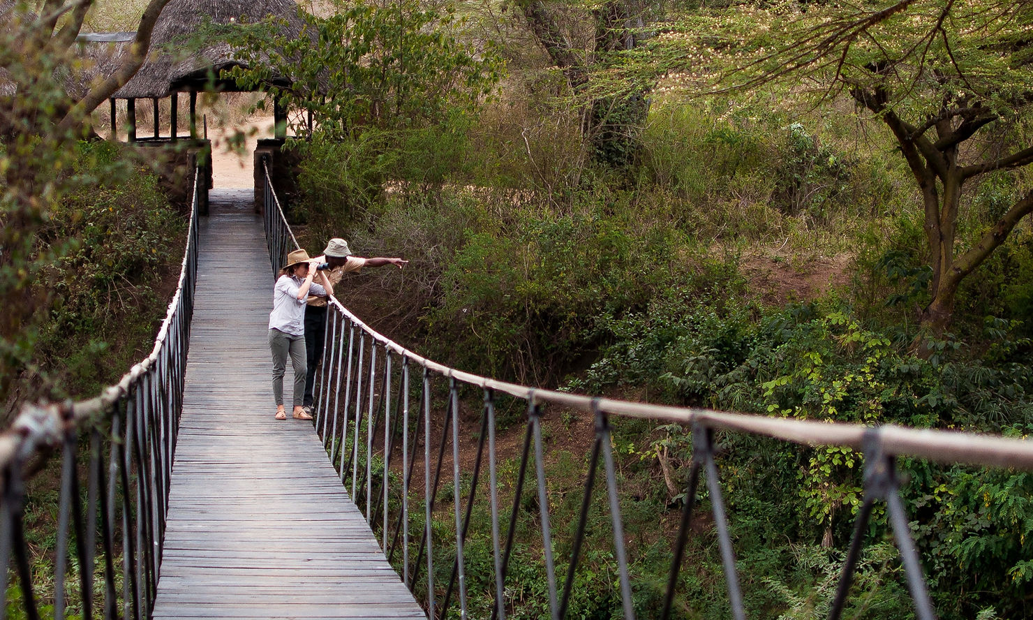 Ololo Guide and Guest on Ololo Lodge Bridge