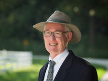jeffrey gahris. a man in a suit wearing a hat.