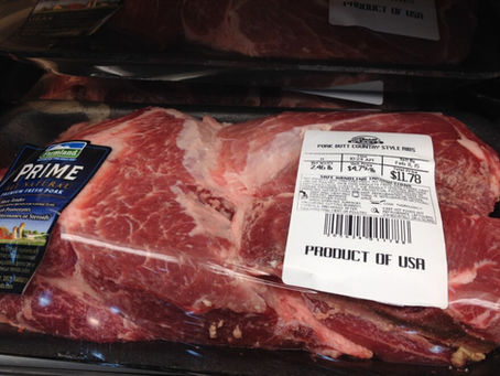 Package of grass-fed beef stamped with a "Raised in the USA" label