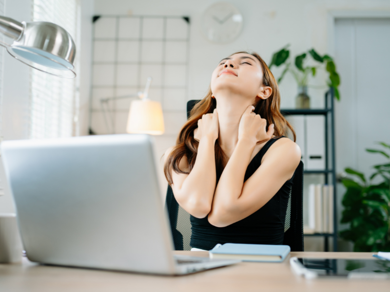 Office worker stretching to reduce sedentary lifestyle effects