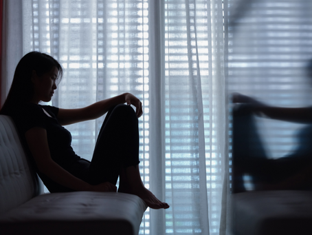 Young adult sitting alone