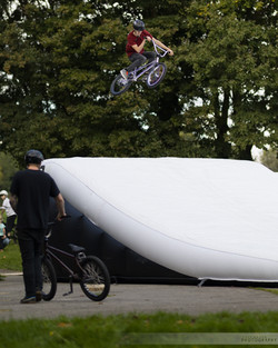 bmx jumping on airbag