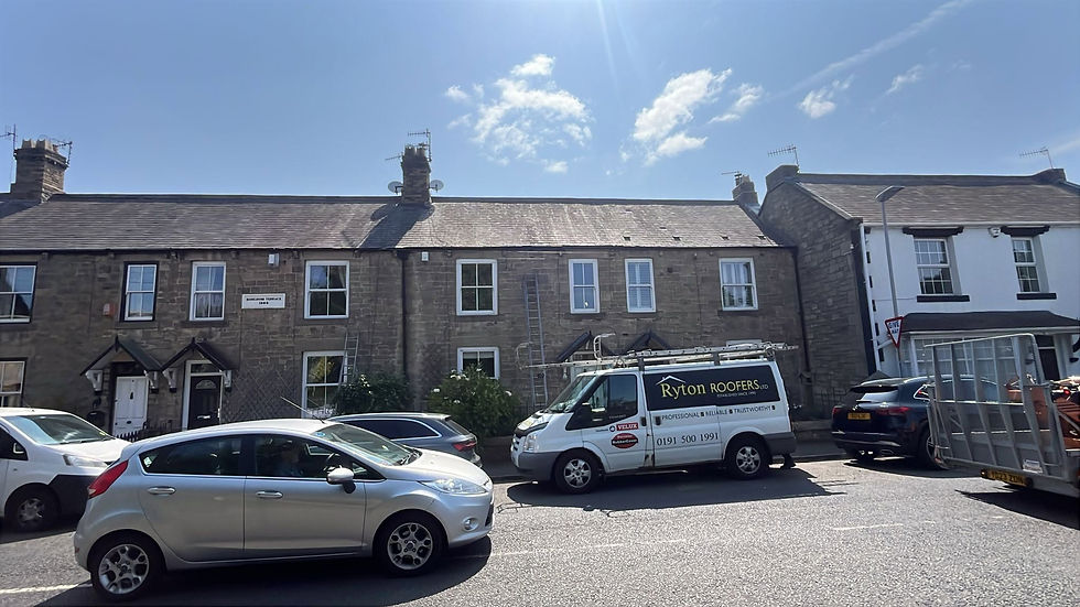 Ryton Roofers van parked outside a stone terraced row of houses