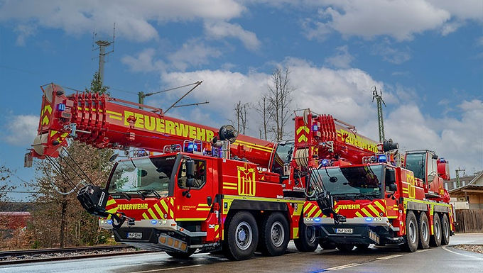 30-Second Takeaway The Munich Fire Service has added two new Liebherr LTM 1070-4.2 mobile cranes to its emergency response fleet, replacing cranes that had been in service since the 1990s. The identical 70-tonne cranes improve operational reliability, flexibility, and lifting capability for complex rescue operations across Munich and neighbouring regions. Munich Fire Service Modernises Fleet with Two New Liebherr LTM 1070-4.2 Cranes The Munich Fire Service has officially placed two new Liebherr LTM 1070-4.2 fire brigade cranes into operation as part of a major fleet modernisation initiative. The new 70-tonne, 4-axle mobile cranes replace two older units built in 1991 and 1998, strengthening the fire brigade’s ability to respond to demanding technical rescue operations both within Munich and in surrounding districts. According to the Munich Fire Service, operational reliability was one of the primary reasons behind the investment. “The reliability of vehicles and equipment is a very important issue for us as a fire service,” explained Dominik Franz, fire officer at the Munich Fire Service. “The previous cranes served us reliably for many years, but as they age, the risk of technical faults and the cost of repairs increase significantly.” Two Identical Cranes Improve Operational Readiness and Flexibility The Munich Fire Service strategically positioned the two new cranes at separate locations across the city to meet emergency response requirements. Cranes Stationed Across Munich for Rapid Response Munich’s fire service requirements plan specifies that two fire brigade cranes must be available with a maximum response time of 30 minutes. To achieve this, the new cranes are stationed in: North-west Munich South-east Munich This deployment strategy ensures rapid access across the city and surrounding operational areas. Tandem Lifting Capability Enhances Rescue Operations The two identical cranes can also operate together for tandem lifting operations when required. According to Dominik Franz, standardising around identical crane models delivers important tactical advantages. “With two identical cranes, we gain not only redundancy but also tactical flexibility,” said Franz. “Particularly in complex operational situations, it is a major advantage to have identical technology with identical performance data at our disposal.” Liebherr LTM 1070-4.2 Selected Following Europe-Wide Tender The Liebherr LTM 1070-4.2 was selected after a Europe-wide procurement tender process. Technical Performance and Fire Service Equipment Were Key Factors Munich Fire Service officials said the complete package offered by Liebherr including both the mobile crane and specialised fire brigade equipment played a decisive role in the purchasing decision. Key operational requirements included: High lifting capacity with ballast carried on the crane Excellent manoeuvrability Variable outrigger positioning Urban deployment capability Rear recovery winch Integrated intercom system Snow chain compatibility These features were considered critical for operations in Munich’s dense urban environment. Compact Design Supports Urban Rescue Operations The compact size and flexibility of the LTM 1070-4.2 were especially important for rescue operations in confined city areas. “The LTM 1070-4.2 offers exactly the combination of performance, compactness and flexibility that we need for our operations,” emphasised Franz. “What’s more, this crane has already proven itself with other fire services.” Fire Brigade Cranes Support Complex Technical Rescue Scenarios The Munich Fire Brigade deploys heavy rescue cranes during incidents where conventional rescue resources are no longer sufficient. Cranes Used for Major Rescue and Recovery Operations Typical deployment scenarios include: Serious road accidents involving lorries and buses Tram and rail accidents Recovery of overturned construction cranes Storm damage operations Rescue operations involving heights and confined spaces The cranes may also be requested to support neighbouring districts during major emergency incidents. Urban Infrastructure and Construction Risks Increase Demand The increasing complexity of urban infrastructure projects and heavy transport operations continues driving demand for specialised heavy rescue equipment within emergency response services. The Munich Fire Service said the new Liebherr cranes significantly improve its readiness for these technically demanding operations. Comprehensive Training Programme Delivered Before Commissioning Before entering operational service, all Munich Fire Brigade crane personnel completed an extensive training programme. Instructor and Driver Training Conducted at Liebherr Facilities The training programme included: Multi-day instructor training at Liebherr in Ehingen Driver training at the Münsingen military training area Operational training for approximately 50 crane operators Additional Recovery Training Enhanced Operational Preparedness The programme also included an external seminar focused on vehicle and machinery recovery operations. According to the Munich Fire Service, close cooperation with Liebherr was maintained throughout the procurement and commissioning process. “The collaboration with Liebherr was very professional throughout the entire procurement process,” said Franz. “We have received two high-quality cranes that provide us with optimal support in our daily work.” About Munich Fire Service The Munich Fire Service is one of Germany’s largest professional fire brigades, providing fire protection, technical rescue, emergency response, and disaster management services throughout the City of Munich and surrounding areas. The organisation operates specialised rescue equipment and technical response units designed to handle complex urban emergencies, infrastructure incidents, transport accidents, and large-scale disaster situations. Website:https://www.feuerwehr-muenchen.de About Liebherr Founded in 1949, the Liebherr Group is one of the world’s leading manufacturers of construction and heavy lifting equipment. The company produces a wide range of cranes, earthmoving machinery, mining equipment, and industrial solutions serving infrastructure, logistics, energy, and construction industries worldwide. Liebherr’s mobile crane division is internationally recognised for advanced all-terrain crane technologies, emergency response applications, and innovative lifting systems designed for complex operational environments. Website:https://www.liebherr.com Frequently Asked Questions What cranes did the Munich Fire Brigade purchase? The Munich Fire Service purchased two Liebherr LTM 1070-4.2 mobile cranes for technical rescue and emergency response operations. Why did Munich replace its older fire brigade cranes? The older cranes, built in 1991 and 1998, were becoming increasingly costly to maintain and carried a higher risk of technical failures. What is the lifting capacity of the Liebherr LTM 1070-4.2? The Liebherr LTM 1070-4.2 is a 70-tonne, 4-axle all-terrain mobile crane. What types of emergencies will the cranes support? The cranes will support major technical rescue operations including road accidents, rail incidents, crane recoveries, storm response, and rescue operations involving heights and confined spaces. How many crane operators were trained for the new Liebherr cranes? Approximately 50 crane operators from the Munich Fire Brigade completed specialised training before the cranes entered operational service.