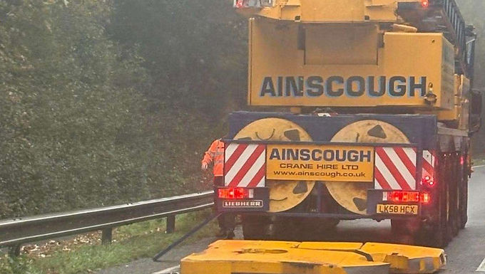 30-Second Takeaway An Ainscough all-terrain crane dropped a fixed rear counterweight slab while travelling on a public road in Kent last week. The incident occurred on the A249 near Maidstone and, fortunately, resulted in no injuries or vehicle damage. Ainscough has completed an initial investigation, identified a failed securing bolt as the primary cause, and issued an industry-wide alert encouraging crane owners to review counterweight fixing inspections. Incident Overview An all-terrain mobile crane from the Ainscough Crane Hire fleet dropped a fixed rear counterweight slab while travelling north on the A249 Detling Hill, near the Kent Showground, close to Maidstone, on Wednesday, October 29th. The crane was travelling on a public road when the counterweight detached from the rear of the carrier and landed on the carriageway. No other vehicles were involved and no injuries were reported, though traffic was temporarily delayed while the incident was managed. What Is Known Location: A249 Detling Hill, near Maidstone, Kent Crane involved: Liebherr LTM 1100 all-terrain crane Owner/operator: Ainscough Crane Hire Incident: Fixed rear counterweight slab detached while travelling Injuries: None reported Third-party damage: None reported Ainscough operates a depot in Maidstone, and the crane was believed to be travelling to a job at the time of the incident. Findings From Initial Investigation Following an internal review, Ainscough issued a detailed statement to alert other crane owners and operators. According to the company: One of the main fixed counterweight securing bolts failed This caused the counterweight to drop on one side The resulting lateral loading led to the failure of the second main fixing bolt The crane was compliant with Ainscough’s maintenance policy at the time Actions Taken by Ainscough In response to the incident, Ainscough has: Launched an immediate service campaign to inspect fixing bolts on all cranes fitted with fixed rear counterweight slabs Confirmed that counterweight bolt inspection, removal, refitting, and re-torquing already form part of its periodic service regime Initiated a review of maintenance criteria in collaboration with the manufacturer to further reduce the risk of recurrence Ainscough emphasized that while the event was extremely rare, the potential consequences warranted immediate and transparent action. Industry Alert to Crane Owners Ainscough concluded its statement by urging other crane owners and operators to: “Ensure that the inspection of these bolts is included within regular maintenance activities.” The company’s decision to publicly share its findings is intended to support industry-wide learning and prevent similar incidents elsewhere. Why Incidents Like This Can Occur Fixed counterweight systems are subject to: Continuous vibration during road travel Cyclic loading on securing bolts Potential torque relaxation over time Even when equipment is well maintained, fastener integrity remains critical, particularly on cranes operating frequently on public highways. Industry Reminder Dropped counterweights on public roads pose an extreme hazard to other road users. The absence of injuries in this incident was fortunate. This event reinforces the importance of fastener integrity, torque discipline, and proactive inspection regimes, even within well-maintained fleets. Editorial Note Crane Hub Global reports on crane incidents to support learning and prevention across the lifting industry. This article is based on information released directly by Ainscough Crane Hire and reflects findings available at the time of publication. How Incidents Like This Can Be Prevented Periodic Bolt Removal and Re-Torque Counterweight fixing bolts should be periodically removed, inspected, refitted, and torqued to specification, not simply checked visually. Manufacturer-Aligned Maintenance Criteria Inspection intervals and torque procedures should be reviewed jointly with OEM guidance and adjusted based on real-world operating conditions. Vibration and Travel Exposure Monitoring High-mileage or frequently travelled cranes may require enhanced inspection frequency due to increased vibration exposure. Post-Incident Knowledge Sharing Transparent reporting of rare but high-risk events supports industry learning and risk reduction.