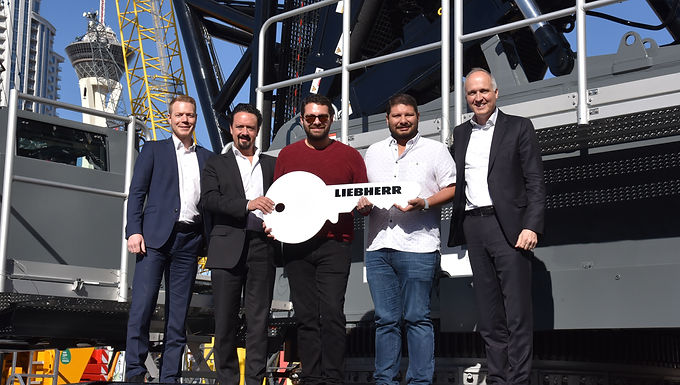 30-Second Takeaway Mexican lifting specialist ESEASA has expanded its fleet with the Liebherr LR 1700-1.0W narrow-track crawler crane , ordered at ConExpo 2023, alongside multiple mobile and rough-terrain cranes. The 700-tonne crawler is designed specifically for modern wind turbine and energy infrastructure projects, offering higher lifting capacities, greater hook heights, and advanced ballasting systems. The investment strengthens ESEASA’s ability to support wind, oil, gas, and offshore platform assembly projects across Mexico. ESEASA Orders 700-Tonne Narrow-Track Crawler Crane at ConExpo 2023 ESEASA ordered the Liebherr LR 1700-1.0W at ConExpo 2023 as part of a comprehensive fleet package that also included a Liebherr LTM 1250-5.1 and two LRT 1090-2.1 rough-terrain cranes . Since then, the company has further expanded its fleet with the addition of a Liebherr LTM 1150-5.3 . The order was formalized with senior leadership from both organizations, including Daniel Pitzer (CFO, Liebherr-Werk Ehingen GmbH) , Christian Tableros (Sales Director, Liebherr Mexico) , Abraham Santos and Aldo Santos (Owners, ESEASA) , and Jan Liebherr (Chairman of the Board of Directors, Liebherr-International AG) . ESEASA operates primarily in the energy sector , with a strong focus on petrochemicals, wind power, oil, gas, and offshore construction . According to company leadership, rapid service response and crane reliability were critical factors in selecting Liebherr. “We require competent service and fast solutions for our projects,” said Abraham Santos . “Delays are not an option. Liebherr provides us with excellent support, well-trained technicians, and consistently high-quality cranes.” Handover in Mexico (from left to right): Christian Tableros (Sales Director Liebherr Mexico), Aldo Santos (Owner ESEASA), Dolores Coronado (Operations Manager ESEASA). LR 1700-1.0W: Benchmark Narrow-Track Crawler Crane The LR 1700-1.0W is the successor to the LR 1600/2-W and is currently the most powerful narrow-track crawler crane in the world . Designed specifically for wind farms, it combines a compact footprint with significantly higher lifting capacities and greater hook heights . Key advantages include: Optimized narrow-track travel gear for turbine-to-turbine movement Capability to handle hub heights up to 170 meters Identical superstructure and equipment to the LR 1700-1.0 Optional luffing jib , unavailable on the predecessor model “The LR 1700-1.0W gives us more power, more height, and modern crawler crane technology,” said Aldo Santos , co-owner of ESEASA. “It’s exactly what today’s wind turbines require.” To meet the increased demands of steering and travel under load, Liebherr equipped the crane with components from the next larger crawler crane class , ensuring stability and durability even under extreme conditions. Advanced Ballasting for Wind Turbine Assembly The LR 1700-1.0W incorporates Liebherr’s proven V-Frame® and VarioTray® systems, already established on larger crawler cranes such as the LR 1800-1.0 and LR 11000. V-Frame® allows continuous ballast radius adjustment between 13 and 21 meters VarioTray® enables fast installation or removal of counterweight frames without stacking plates Eliminates rigid ballasting systems at large radii These systems significantly reduce setup time and improve flexibility key advantages when assembling wind turbines in restricted or remote locations. The LR 1700-1.0W offers state-of-the-art crawler crane technology such as V-Frame and VarioTray. Supporting Mobile and Rough-Terrain Fleet In addition to the crawler crane, ESEASA continues to expand its mobile crane portfolio: Liebherr LTM 1250-5.1 Most powerful 5-axle mobile crane in the world Features VarioBallast® , VarioBase® , ECOmode, and ECOdrive Optimized for high capacities on confined job sites Liebherr LRT 1090-2.1 Designed with safety as a priority Standard outrigger monitoring system Equipped with VarioBase® for increased flexibility and capacity Rope-pull telescoping system for fast, controlled boom extension Liebherr LTM 1150-5.3 150-tonne capacity with long telescopic boom Can transport nine tonnes of ballast on public roads Single-engine concept improves efficiency and lifting performance Compatible jib systems across Liebherr’s 100–180-tonne range Wind, Energy, and Offshore Applications ESEASA ordered the wide standard chassis for the LR 1700-1.0W, enabling on-site travel with a load on the hook a key requirement for wind farms and industrial projects. The crane is already earmarked for engineering, procurement, and construction work on six oil drilling platforms , where its lifting height, stability, and load capacity are essential. ESEASA’s continued investment follows earlier orders: Seven rough-terrain cranes in 2021 Five additional rough-terrain cranes and two all-terrain cranes at Bauma 2022 Multiple LRT 1130-2.1 units added after ConExpo 2023 About ESEASA ESEASA is a Mexico-based heavy lifting and construction specialist serving the energy, petrochemical, wind power, oil, gas, and offshore sectors . The company provides end-to-end solutions covering engineering, procurement, construction, and commissioning. With a rapidly expanding fleet of crawler, all-terrain, and rough-terrain cranes, ESEASA supports complex lifting projects throughout Mexico and beyond, with a strong focus on reliability, safety, and execution speed. Frequently Asked Questions What makes the LR 1700-1.0W different from the LR 1600/2-W? The LR 1700-1.0W offers significantly higher lifting capacities, greater hook heights, and modern crawler crane technology, including optional luffing jib capability. Why are narrow-track crawler cranes important for wind farms? They can travel between turbines on existing access roads, reduce setup time, and operate efficiently in restricted layouts typical of wind projects. What role does the V-Frame® system play? V-Frame® allows continuous adjustment of the ballast radius, improving flexibility and eliminating the need for rigid ballasting systems. Can the LR 1700-1.0W travel with a load on the hook? Yes. When equipped with the wide standard chassis, it can travel on site with suspended loads, ideal for wind and industrial applications. Which sectors will ESEASA use the crane in? Wind energy, oil and gas, petrochemical plants, offshore platforms, and heavy industrial construction.