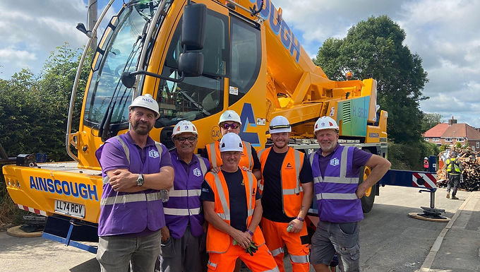 30 Second Takeaway Ainscough Crane Hire has proudly supported the BBC’s DIY SOS programme in a life-changing home transformation project in Freckleton, Lancashire. Providing specialist lifting and transport equipment including a Liebherr 50-tonne Hybrid City Crane and a FASSI F820 HIAB Ainscough helped deliver a safe, accessible home for Daniel, a young disabled adult returning home after a long hospital stay. Supporting a Remarkable DIY SOS Project in Lancashire Ainscough Crane Hire was honoured to support the BBC’s much-loved programme DIY SOS during a major home renovation project in Freckleton, Lancashire. The project focused on transforming the family home of Daniel, a young disabled adult with complex needs, to allow him to safely return home after an extended period in hospital. Led by Nick Knowles, designer Gaby Blackman, and the dedicated DIY SOS production team at Southshore, the build brought together a vast network of volunteers, tradespeople, and local businesses from across the North West. Specialist Lifting and Transport Support from Ainscough As part of its contribution, Ainscough Crane Hire supplied key equipment critical to the success of the build, including: A brand-new FASSI UK Ltd F820 HIAB for specialist transport operations A Liebherr 50-tonne Hybrid City Crane, used extensively to support the safe installation of roof trusses The hybrid city crane provided a compact, efficient, and low-emission lifting solution, well suited to the residential environment and tight working conditions on site. End-to-End Logistics and On-Site Collaboration Ainscough’s involvement began with the collection and delivery of essential equipment from London to the Freckleton site. Throughout the project, Ainscough’s team worked closely with: Site managers Tradespeople DIY SOS volunteers This close collaboration ensured all heavy lifting and transport requirements were delivered safely, efficiently, and on schedule, allowing the wider team to focus on completing the transformation within the programme’s demanding timeframe. Ainscough Perspective Joe Embery, Transport Operations Planner at Ainscough, said: “It has been an absolute privilege to play a part in this incredible transformation. The DIY SOS team, alongside the many selfless tradespeople and volunteers, created something truly special for Daniel and his family. We’re proud that our cranes and transport services could help bring the vision to life and contribute to such a meaningful cause.” Episode to Air on BBC One The completed project will feature in an upcoming episode of DIY SOS, airing on BBC One later this year. The programme will showcase the extraordinary teamwork, generosity, and compassion behind the build, highlighting how industry expertise and community spirit combined to create a safe, accessible, and welcoming home for Daniel. About Ainscough Crane Hire Ainscough Crane Hire is the UK’s largest crane rental company, operating a fleet of more than 400 cranes from 30 locations nationwide. Alongside its commercial operations, Ainscough is committed to community engagement, social responsibility, and supporting projects that deliver lasting positive impact. 🔗 Website: https://www.ainscough.co.uk About DIY SOS DIY SOS is a long-running BBC television programme that brings together tradespeople, volunteers, and businesses to transform homes for families facing extraordinary challenges. Led by presenter Nick Knowles, the programme is known for its powerful storytelling and life-changing results. 🔗 BBC DIY SOS: https://www.bbc.co.uk/programmes/b006v5hl Frequently Asked Questions What project did Ainscough support? Ainscough supported a DIY SOS home transformation for a young disabled adult in Freckleton, Lancashire. What equipment did Ainscough provide? Ainscough supplied a FASSI F820 HIAB for transport and a Liebherr 50-tonne Hybrid City Crane for lifting roof trusses. Why was a hybrid city crane used? The hybrid city crane provided a compact, efficient, and lower-emission lifting solution, ideal for a residential environment. When will the episode air? The episode will air on BBC One later this year. Who led the DIY SOS project? The project was led by Nick Knowles, Gaby Blackman, and the DIY SOS production team at Southshore.