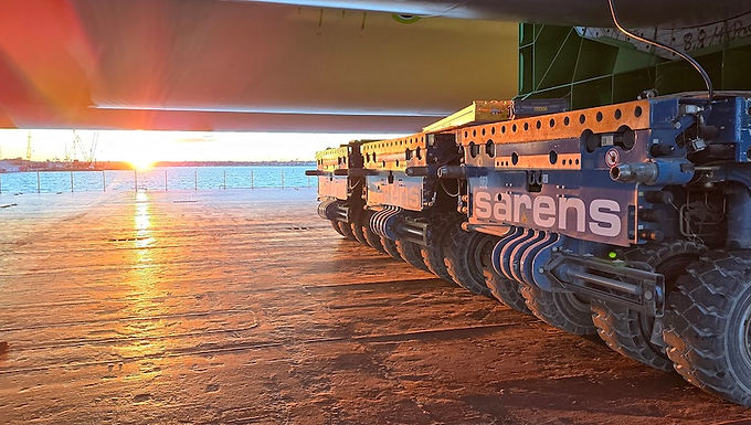 30-Second Takeaway Sarens is nearing completion of its extensive work on the Coastal Virginia Offshore Wind project after managing large-scale marshalling and heavy lifting operations since 2023. The project involved handling hundreds of monopiles and transition pieces, complex SPMT transport operations, and major offshore substation components while meeting strict environmental and scheduling requirements. Sarens Advances Final Phase of Coastal Virginia Offshore Wind Operations Heavy lifting and engineered transport specialist Sarens is approaching the final stage of its work on the Coastal Virginia Offshore Wind (CVOW) project, one of the largest offshore wind developments currently underway in the United States. Since operations began in 2023 at Portsmouth Marine Terminal, Sarens has been responsible for the onshore marshalling and engineering scope on behalf of Virginia International Terminals. The project represents a major milestone in the continued expansion of offshore wind infrastructure along the U.S. East Coast. Large-Scale Offshore Components Required Complex Handling Operations The scale of the CVOW project required extensive heavy lifting, transport coordination, and engineering support throughout the marshalling campaign. Sarens Managed Hundreds of Offshore Wind Components The company handled: 176 monopiles 176 transition pieces Pin piles Installation templates Three offshore substation topsides Each offshore substation topside weighed approximately 4,000 tonnes, requiring highly coordinated lifting and transport operations. Intensive Operations Demanded Long-Term Efficiency To maintain operational productivity over the extended project duration, Sarens implemented several engineered handling solutions designed to improve safety, accessibility, and operational consistency. The project required a sustained high-volume operational approach across both lifting and transport activities. Engineered Steel Supports Improved Operational Efficiency One of the project’s key innovations involved the use of specially engineered steel support systems for monopile handling. Custom Support System Enhanced Accessibility and Stability According to Sarens, the engineered supports allowed full accessibility to the monopiles while also meeting strict ground-bearing pressure requirements across the terminal site. The solution improved operational workflow and helped maintain schedule reliability throughout the project. Ground-Bearing Requirements Critical for Heavy Offshore Components Given the extreme size and weight of offshore wind components, managing ground loads and operational stability formed a critical part of the engineering strategy. The custom support systems enabled safer and more efficient storage, handling, and mobilisation activities across the terminal operations. Hundreds of SPMT Movements and Heavy Lifts Completed The overall campaign involved an intensive series of transport and lifting operations throughout the marshalling programme. SPMTs Played Central Role in Component Handling Sarens completed approximately: 740 self-propelled modular transporter (SPMT) movements 382 lifts using a Liebherr CC8800 crawler crane These operations supported the movement, positioning, and load-out preparation of offshore wind components before transport to installation vessels. Liebherr CC8800 Supported High-Capacity Lifting Operations The Liebherr CC8800 crawler crane handled many of the project’s heaviest lifts, including major offshore infrastructure components and substation topsides.The crane’s high lifting capacity and stability were critical for maintaining operational efficiency across the demanding offshore wind campaign. Environmental Restrictions Added Additional Project Complexity Environmental regulations also played a major role in the scheduling and execution of offshore installation activities. Offshore Piling Subject to Whale Migration Restrictions Offshore piling activities had to be completed outside restricted environmental windows linked to whale migration activity along the U.S. East Coast. These regulations created strict operational deadlines for offshore installation work. Early Completion Helped Avoid Project Delays Through close coordination between project stakeholders, all monopile installation activities were completed one month ahead of the required deadline. This early completion helped avoid scheduling disruptions and ensured continued project progress. Final Transition Piece Operations Now Underway As of March 2026, Sarens confirmed that only ten transition pieces remain to be handled before completion of the project’s load-out activities. Project Nearing Completion After Multi-Year Campaign The nearing completion of the marshalling scope marks a significant milestone in one of the largest offshore wind infrastructure programmes currently under development in North America. The CVOW project continues reflecting growing investment in large-scale renewable energy infrastructure and offshore wind capacity across the United States. About Sarens Sarens is a global leader in crane rental, heavy lifting, engineered transport, and infrastructure solutions. The company operates one of the world’s largest fleets of cranes and specialised transport equipment, supporting major energy, infrastructure, industrial, and offshore projects worldwide. Sarens is heavily involved in offshore wind development projects globally, providing lifting and logistics support for renewable energy infrastructure installations. Website:https://www.sarens.com About Coastal Virginia Offshore Wind (CVOW) The Coastal Virginia Offshore Wind (CVOW) project is one of the largest offshore wind developments in the United States. Located off the coast of Virginia, the project is designed to significantly expand renewable energy generation capacity and support the transition toward lower-carbon energy infrastructure. The project includes large-scale offshore turbine installations, substations, and supporting marine infrastructure. Frequently Asked Questions What is the Coastal Virginia Offshore Wind project? The Coastal Virginia Offshore Wind (CVOW) project is a major offshore wind energy development located off the coast of Virginia in the United States. What role is Sarens playing on the project? Sarens is responsible for the onshore marshalling and engineering scope at Portsmouth Marine Terminal, including handling monopiles, transition pieces, and offshore substations. How many monopiles has Sarens handled? Sarens has handled 176 monopiles and 176 transition pieces during the project. What crane is being used for lifting operations? The project utilised a Liebherr CC8800 crawler crane for many of the heavy lifting operations. Why were environmental restrictions important on the project? Offshore piling activities had to avoid restricted periods linked to whale migration along the U.S. East Coast.