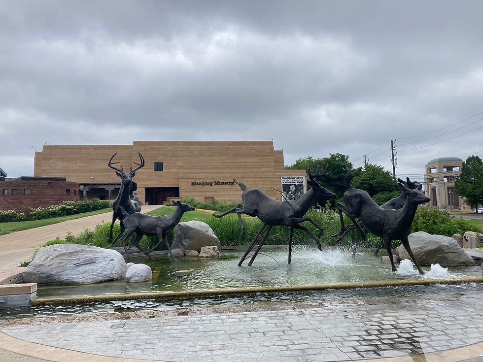 exterior of the Eiteljorg Museum and decorative a statue of deer