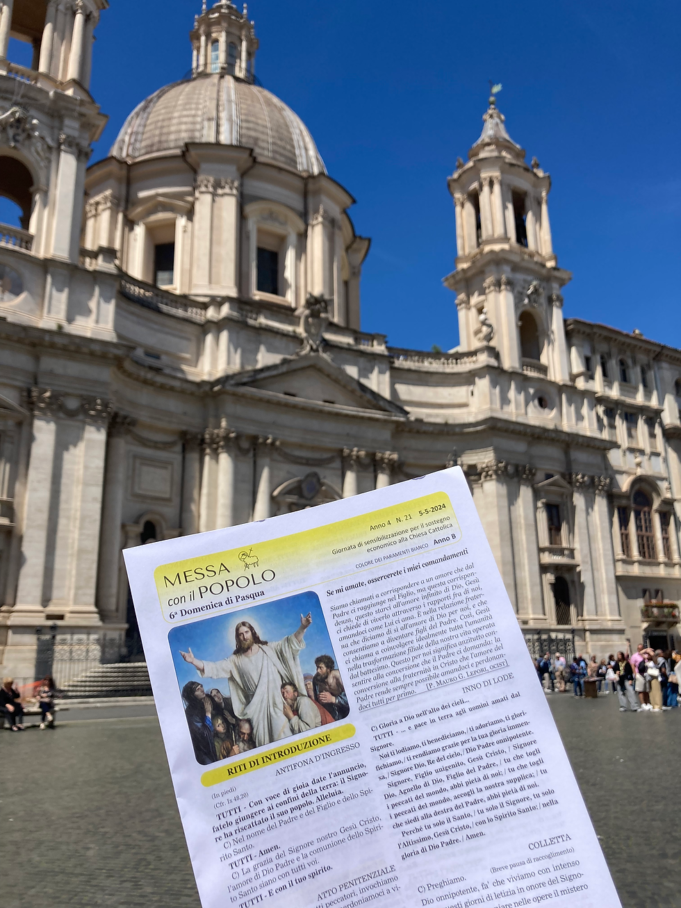 a program in front of a church in Rome