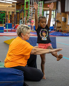 girl in tumble class with coach.jpg