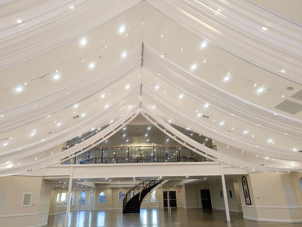 Main Chapel with tent style white chiffon drapery and bistro lights