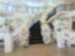 Spiral Staircase decorated in white florals with pops of blue