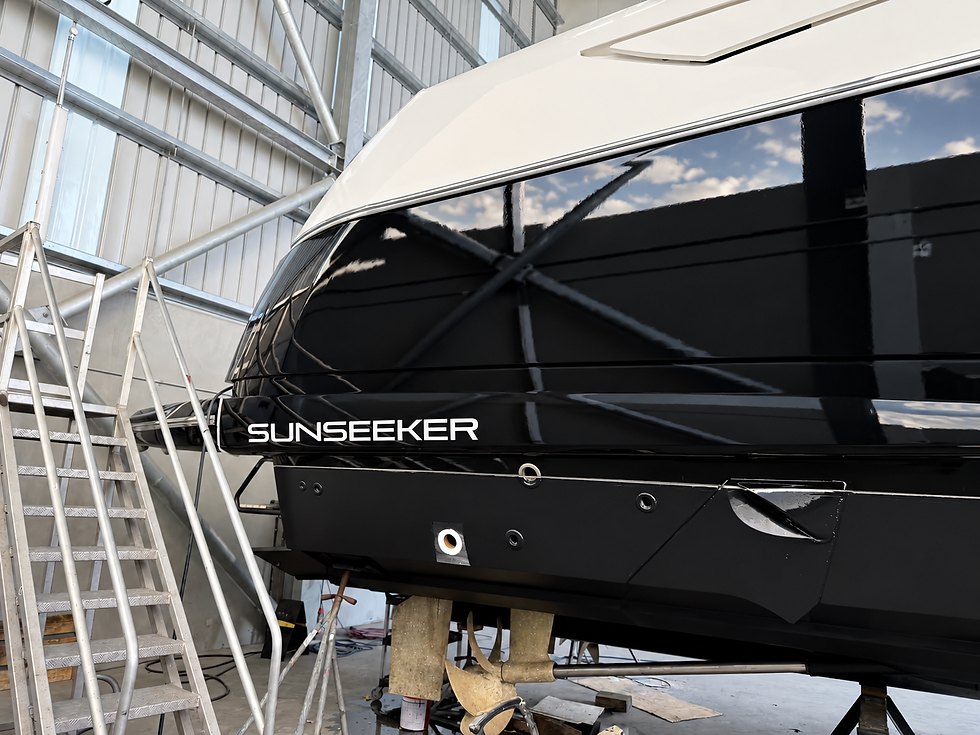 Close-up of gloss black Sunseeker yacht hull wrap and exterior branding