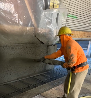 Structural engineer reviewing shoring and foundation blueprints at Golden Gate Shoring office.