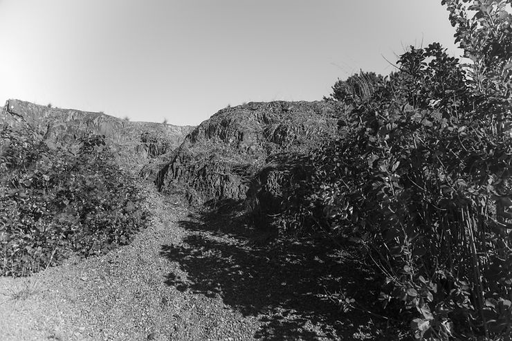 A black and white photograph of the Deakin anticline in Canberra, Australia taken by Megan Kennedy