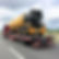equipment transport on flatbed with permits.jpg