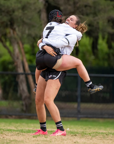 Two players hug after scoring a goal