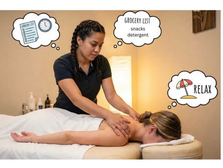 Female massage therapist working on client 