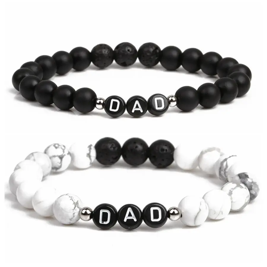 Dad beaded bracelets  cone in 2 colors black lava beads and marble lava beads. Says dad in the middle. On a stretchy thing to fit anyone. 