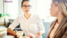 Two women discussing business