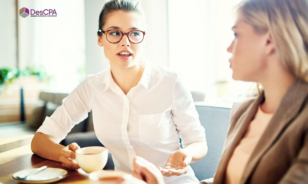 Two women discussing business