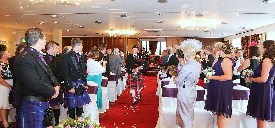 man playing bag pipes