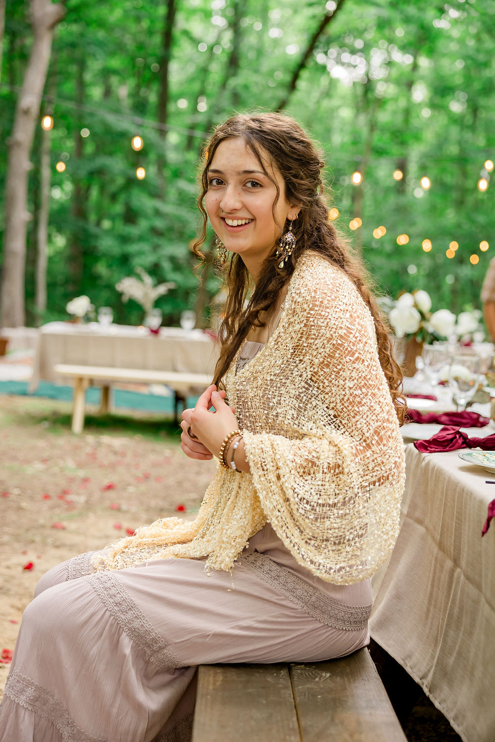 Portrait of Artist Rose, a young woman smiling outdoors at Willow Bend Farm