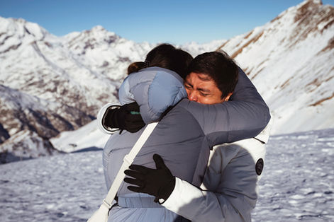 a couple hugs emotionally after their surprise proposal in Zermatt