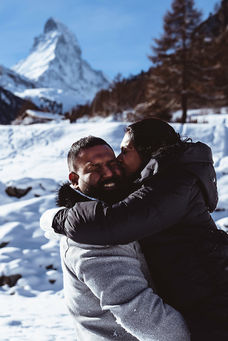 a woman kissing her husband on their vacation in Switzerland