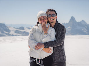 Engaged couple on a glacier in Zermatt for a surprise proposal