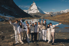 A large family posing in front of the Matterhorn