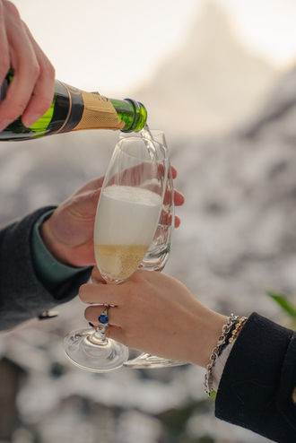 champagne being poured after the proposal